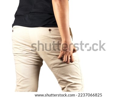 Asian man in reaction of scratching bottom on white background, closeup. Annoying itch or Tinea Cruris. Human body problem or healthcare and medicine concept. Royalty-Free Stock Photo #2237066825