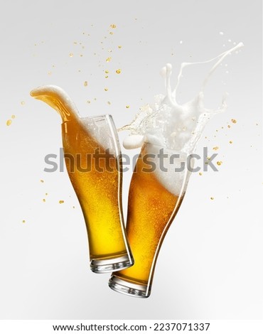 Foam splashes. Two glasses with lager foamy beer isolated over grey background. Traditional taste. Concept of alcohol, oktoberfest, drinks, holidays and festivals. Copy space for ad. Royalty-Free Stock Photo #2237071337