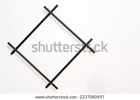black bamboo compostible straw diamond shaped picture frame isolated on a white background
