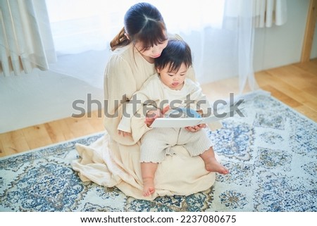Parent and child reading a picture book