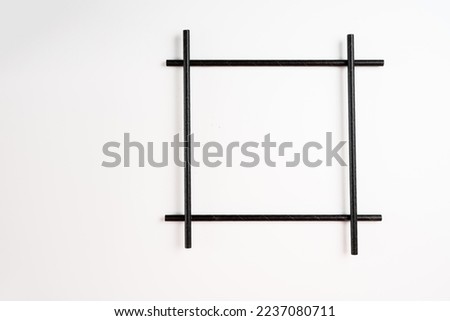 black bamboo compostible straw picture square frame isolated on a white background