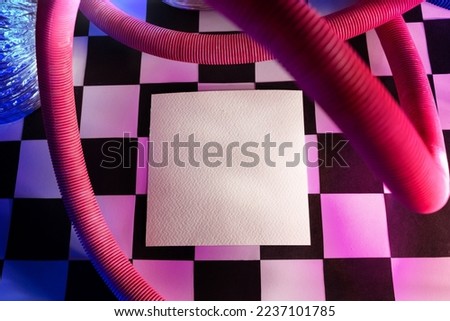 High-ress empty square card realistic mockup with trendy groovy style  chess texture background and also pink and blue neon lights. Colorful vibrant photos can be use for Christmas presentation