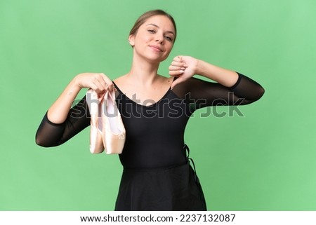 Young beautiful blonde woman practicing ballet over isolated background proud and self-satisfied