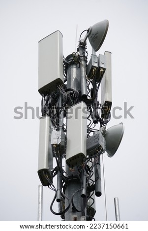 4G and 5G Cell site, Telecommunication tower radio tower or mobile phone base station. Development of communication systems in urban area. Royalty-Free Stock Photo #2237150661