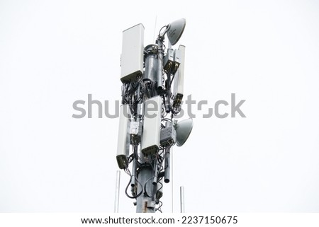 4G and 5G Cell site, Telecommunication tower radio tower or mobile phone base station. Development of communication systems in urban area. Royalty-Free Stock Photo #2237150675