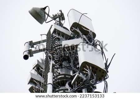 4G and 5G Cell site, Telecommunication tower radio tower or mobile phone base station. Development of communication systems in urban area. Royalty-Free Stock Photo #2237153133
