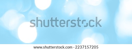 Blurred lights blue background, banner texture. Abstract bokeh with soft light header. Wide screen wallpaper. Panoramic web banner with copy space for design