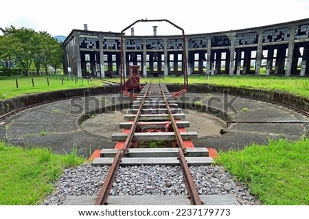 Bungo Mori Roundhouse is railroad heritage in Kusu town, Oita prefecture, Japan. There is a railway turntable for changing direction of the locomotive. Royalty-Free Stock Photo #2237179773