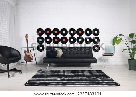 Living room decorated with vinyl records. Interior design Royalty-Free Stock Photo #2237183101
