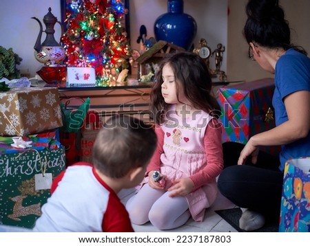 family opening presents on christmas morning