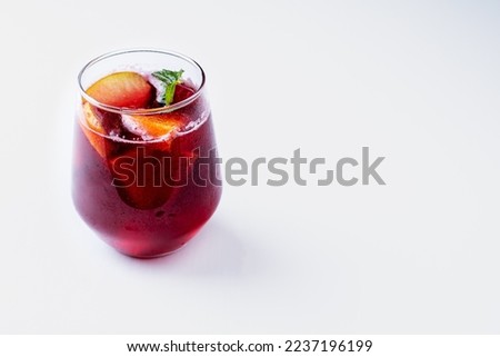 Glass with sangria, with fruits and mint.  Royalty-Free Stock Photo #2237196199