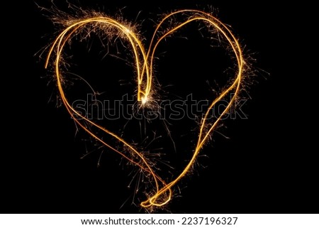 Sparkles heart with sparks, Using camera with slow shutter speed.