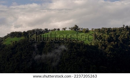 mountains and green hills with clouds in ecuador