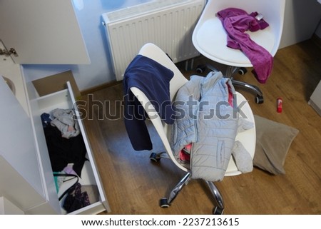 mess, disorder and interior concept - view of messy home kid's room with scattered stuff Royalty-Free Stock Photo #2237213615