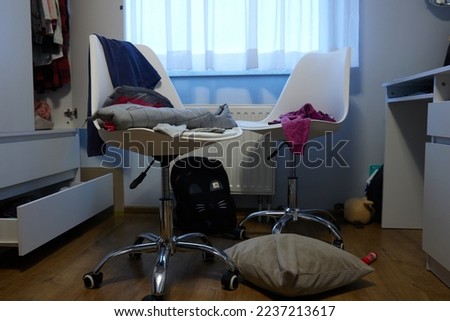 mess, disorder and interior concept - view of messy home kid's room with scattered stuff Royalty-Free Stock Photo #2237213617