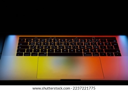 Laptop keyboard, close-up download of laptop keyboard in dark mode. Selective focus.