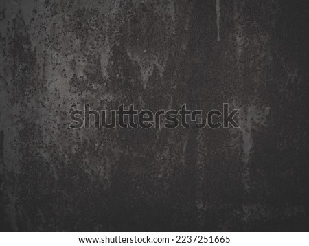 Old rusted metal texture. Rusty iron wall. Rough faded metal surface with spots, noise and grain. Faded dark background for grunge design. Shaded vintage texture with vignette. 