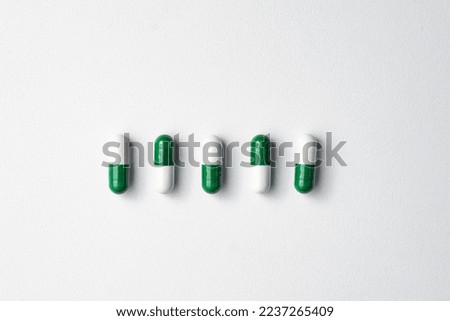 Medical pills on white background with copy space