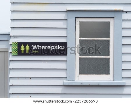 A toilet sign in Maori native language of New Zealand. Wharepaku. Male and Female.