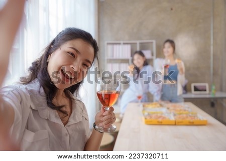 Selfie shot, Group of young asian office girl friends having fun and celebrating pizza on table during party