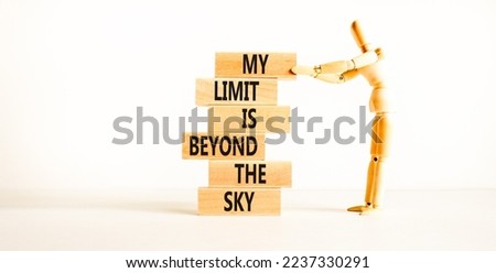 My limit is the sky symbol. Concept words My limit is beyond the sky on wooden blocks on a beautiful white table white background. Businessman icon. Business my limit is beyond the sky concept.