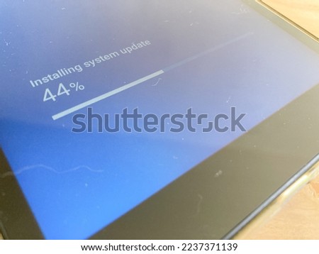 Software update or operating system upgrade to keep the device up to date with added functionality in new version and improve security.  Royalty-Free Stock Photo #2237371139