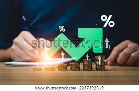 Interest rate and dividend concept, Businessman is calculating income and return on investment in percentage. income, return, retirement, compensation fund, investment, dividend tax, stock market Royalty-Free Stock Photo #2237392519