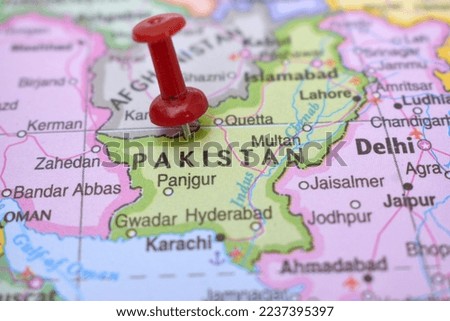 Red Push Pin Pointing on Pakistan World Map Close-Up View Stock Photograph Royalty-Free Stock Photo #2237395397