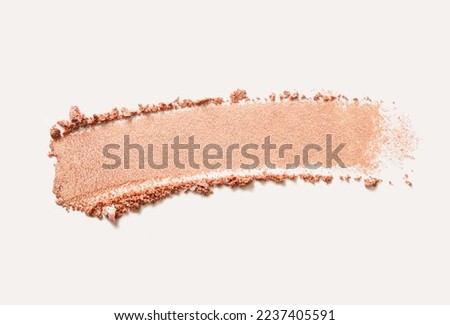 Cosmetic texture bronzer pressed powder smudge with shimmer isolated on light gray background Royalty-Free Stock Photo #2237405591