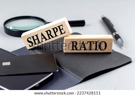 SHARPE RATIO text on a wooden block on black notebook , business concept Royalty-Free Stock Photo #2237428151
