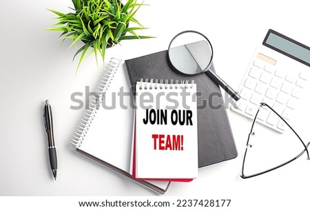 Text JOIN OUR TEAM on a notebook with office tools on white background