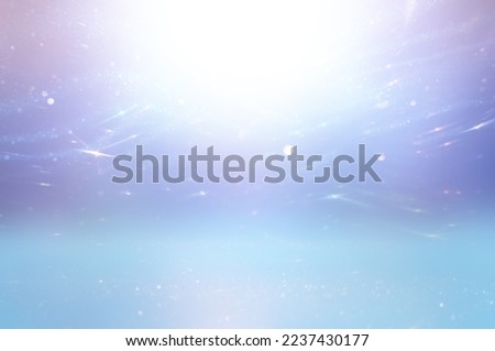 background of abstract glitter lights. gold, blue, pink and silver. de focused