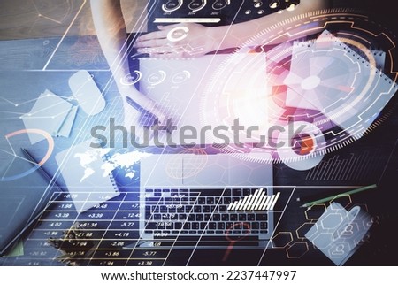 Multi exposure of writing hands on background with data solution hologram. Technology concept.