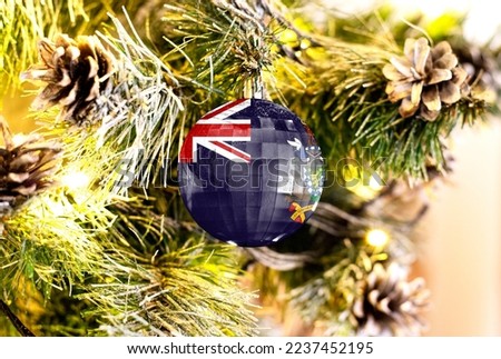 New Year's glass ball with the flag of South Georgia and the South Sandwich Islands against a colorful Christmas background