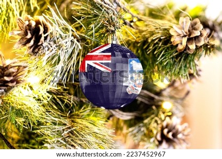 New Year's glass ball with the flag of Falkland Islands against a colorful Christmas background