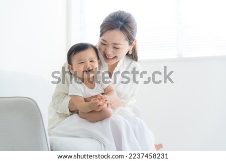 A couple holding a baby and going out Royalty-Free Stock Photo #2237458231