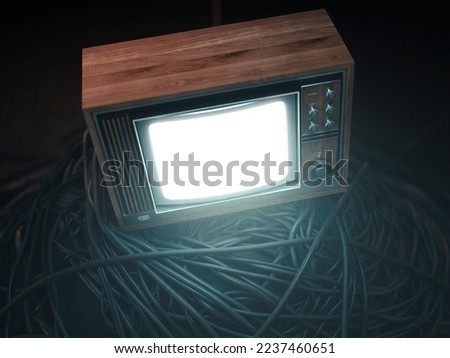 An illuminated vintage 80's television perched on a jumbled pile of black cables on a dark omnious background - 3D render