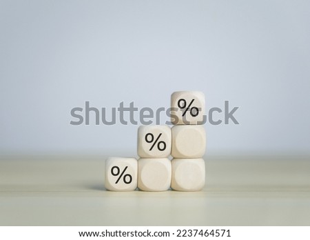 wood block showing percentage symbol icon Business investment ideas to increase profits of stocks, finance, marketing, sales, interest rates. Better economy and discounts