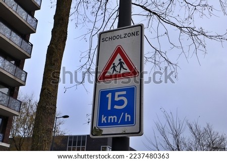 Traffic sign caution schoolzone 15 kmh in IJburg, Amsterdam, the Netherlands