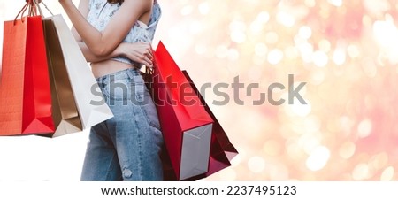 People spending money shopaholic relax wellness concept. No face woman with shopping bags wear blue shirt on day. Weekend city people buying lifestyle. Banner size background.