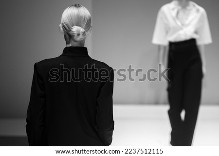 Fashion Show, catwalk runway event, model walking the show finale. Royalty-Free Stock Photo #2237512115
