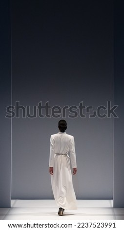 Fashion Show, catwalk runway event, model walking the show finale. Royalty-Free Stock Photo #2237523991