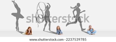 Three children, girls dreaming about future of professional sportsmen. Conceptual image with kids and drawn shadows of ballerina, rhytmic gymnas and running athlete. Concept of childhood, edcucation Royalty-Free Stock Photo #2237539785