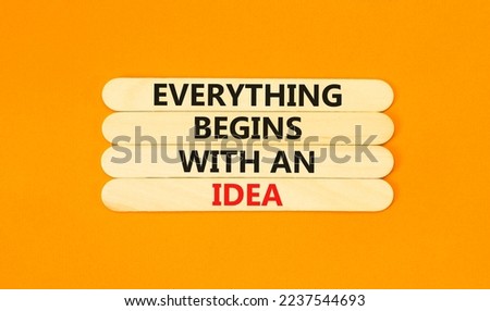Everything begins with an idea symbol. Concept word Everything begins with an idea on wooden sticks. Beautiful orange background. Business everything begins with an idea concept. Copy space.