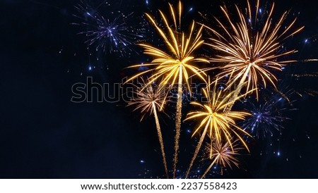 Sylvester, happy new year, new year's eve 2023 background banner - Golden firework fireworks pyrotechnics on dark black night sky Royalty-Free Stock Photo #2237558423