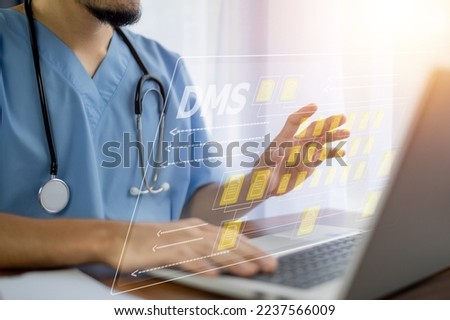 Doctor using software computer Document Management System (DMS), online documentation database process automation to efficiently manage files