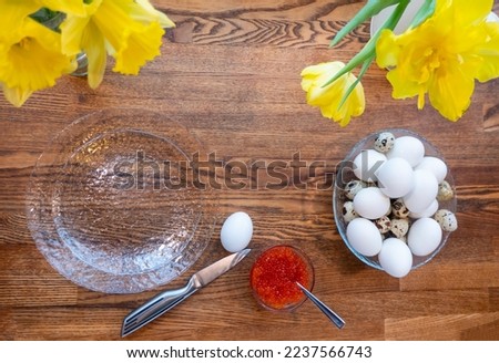 The recipe for making eggs stuffed with red caviar, cooking. Eggs, red caviar, top view, flat lay. Background of festive food products. preparing for Easter, banner with copy space