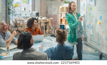 Group Businesspeople have Meeting in Office Conference Room. Female Crisis Manager Using Charts on Whiteboard, Showing Plan how to Save Corporate Strategy After Bad Quarter. Royalty-Free Stock Photo #2237569401