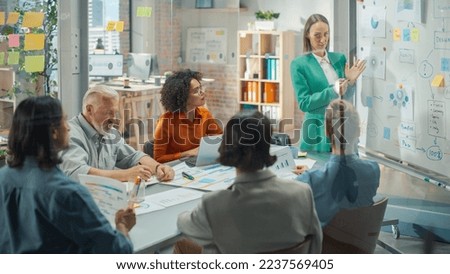 Beautiful Female Manager Holding a Meeting in a Conference Room at a Creative Agency Office. Caucasian Woman Using Whiteboard and Mindmapping Technic to explain Company's Commerce Strategy Royalty-Free Stock Photo #2237569405