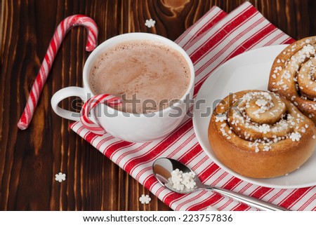 Hot Chocolate Drink. Cinnamon Swirls. Christmas Sweets. Wooden Background.